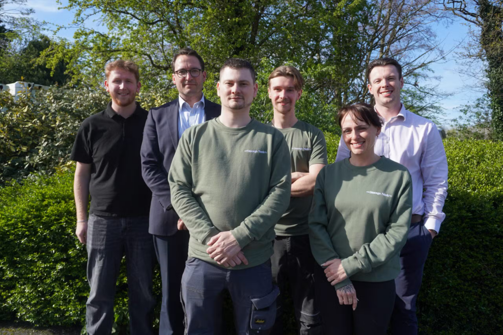 A team of people standing together outdoors